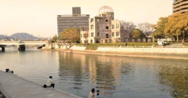 People relaxing along the riverside in Hiroshima Peace Memorial Park