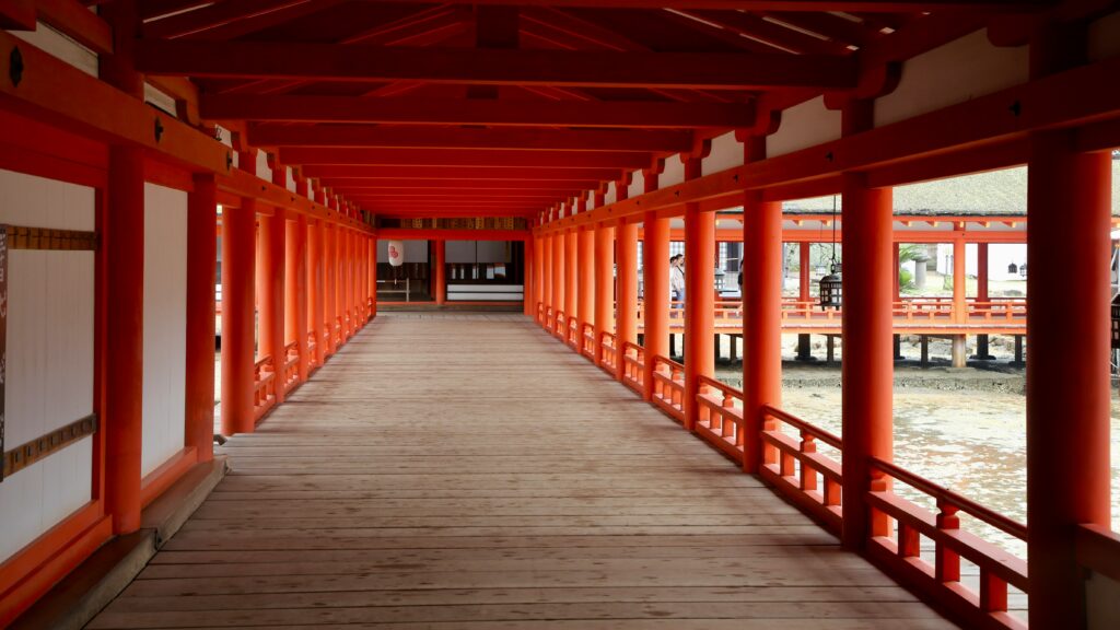A vermilion corridor inside Itsukushima Shrine